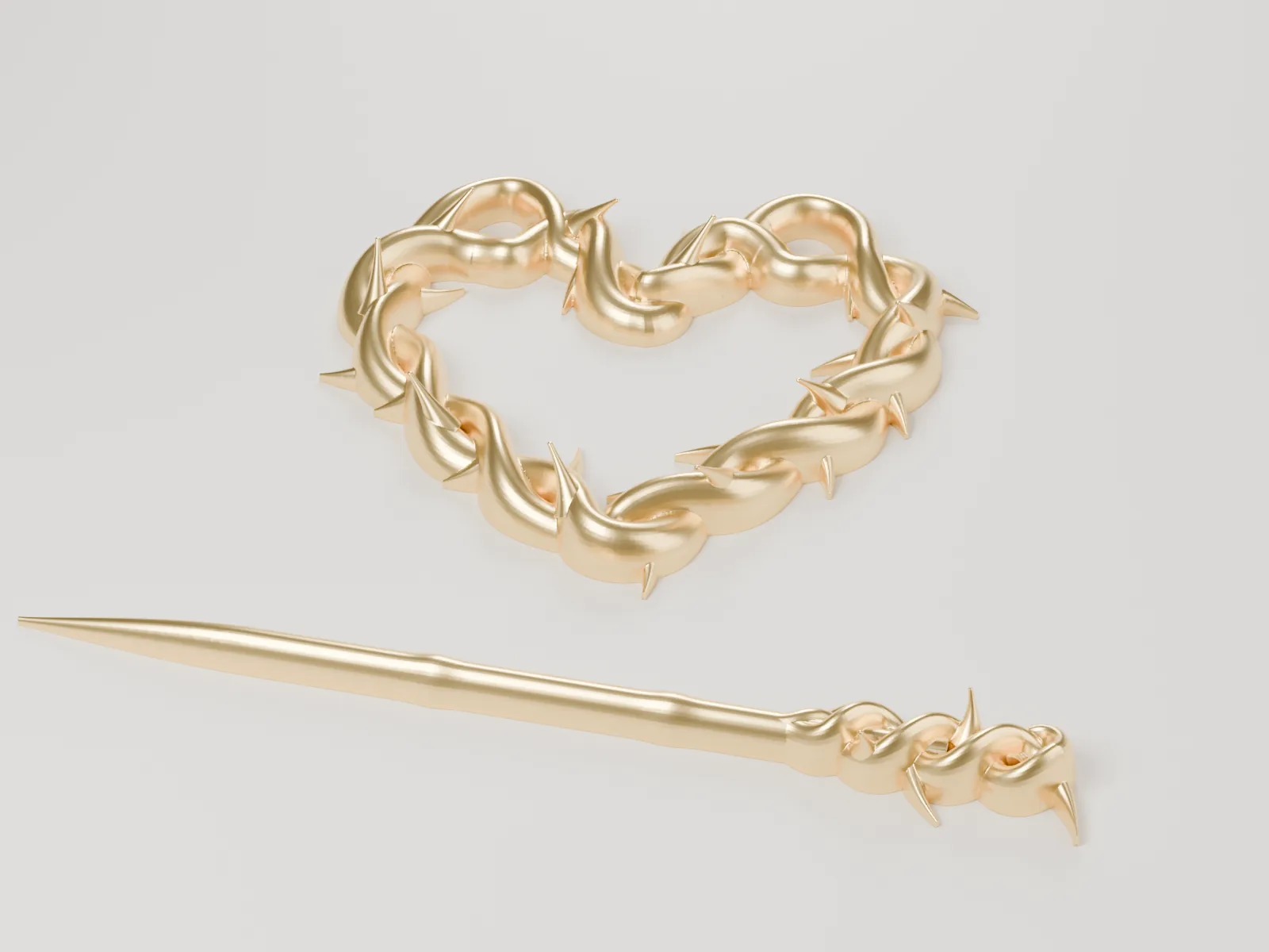 Horquilla de moño con un corazón de dos ramas trenzadas con espinas y su palillo, en dorado